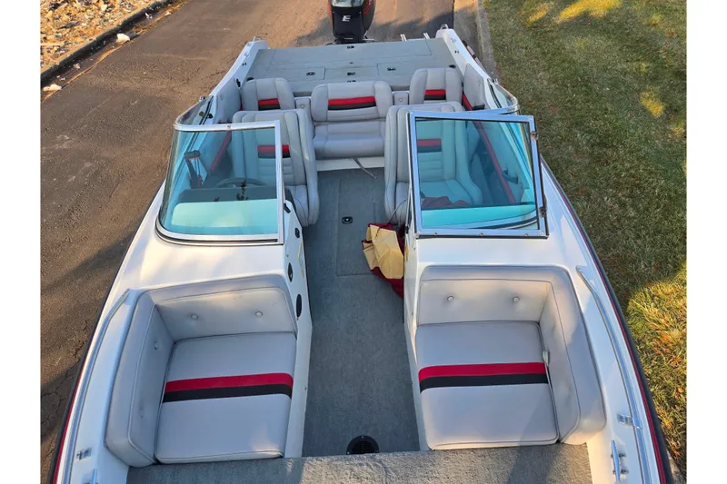 Slide: The Image of 1998 Stratos 290 Ski-N-Fish boat interior with gray and red seating. - 21