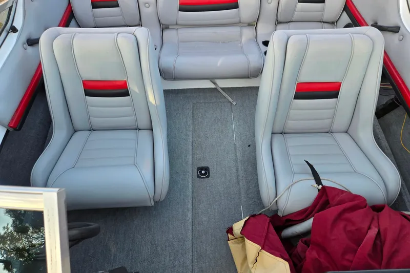 Slide: The Image of 1998 Stratos 290 Ski-N-Fish boat interior with gray and red seating. - 22