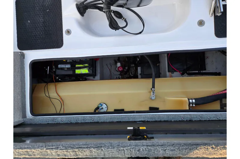 Slide: The Image of 1998 Stratos 290 Ski-N-Fish boat interior showing battery compartment and wiring. - 26