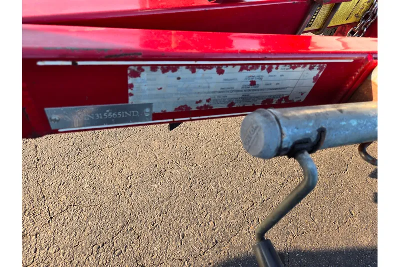 Slide: The Image of Red trailer hitch with worn label, Stratos 290 Ski-N-Fish, 1998 model. - 8