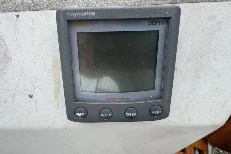 Slide: The Image of Raymarine depth gauge on 1985 Beneteau First 38 sailboat dashboard. - 10