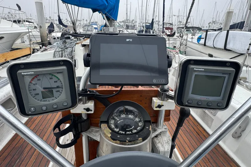 Slide: The Image of Cockpit of 1985 Beneteau First 38 sailboat with navigation instruments and compass. - 14