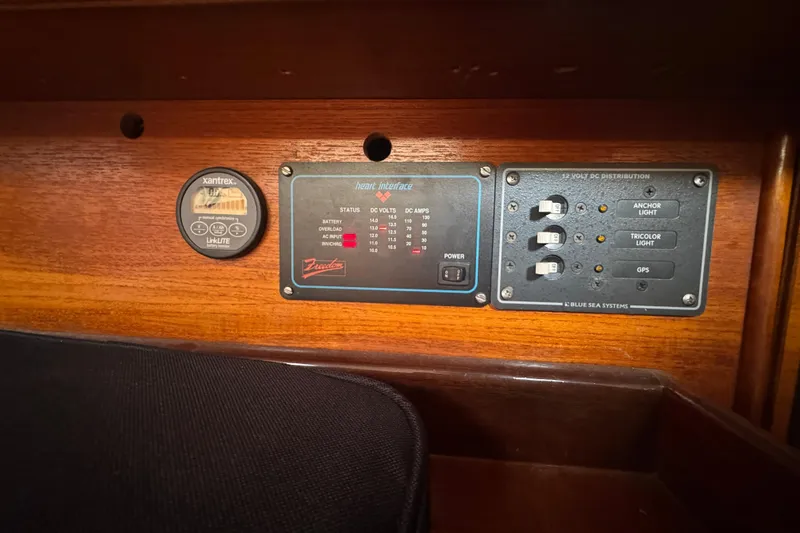 Slide: The Image of Control panel on a 1985 Beneteau First 38 sailboat, featuring Xantrex and Blue Sea Systems. - 30