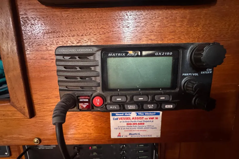 Slide: The Image of VHF radio on 1985 Beneteau First 38 sailboat, featuring Standard Horizon Matrix AIS+ GX2150. - 34
