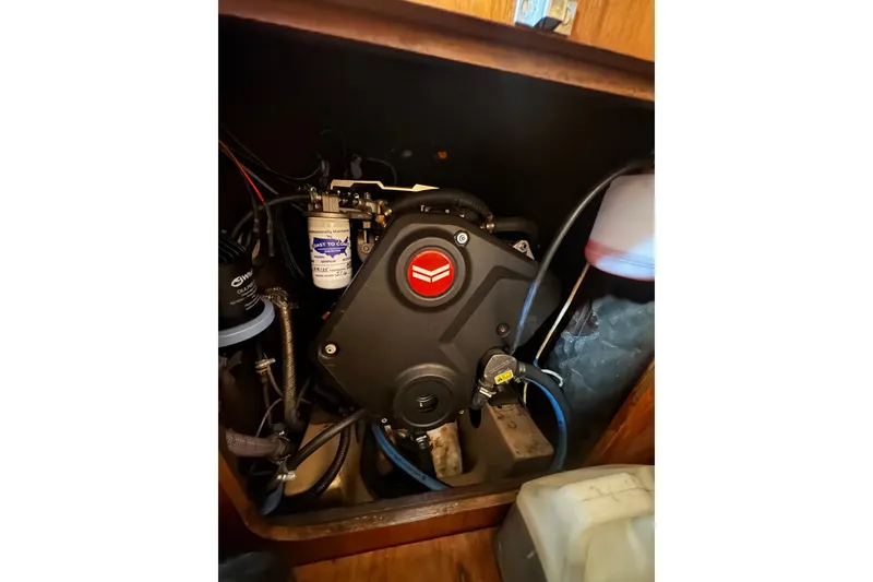 Slide: The Image of Engine compartment of a 1985 Beneteau First 38 sailboat, showcasing mechanical components. - 37