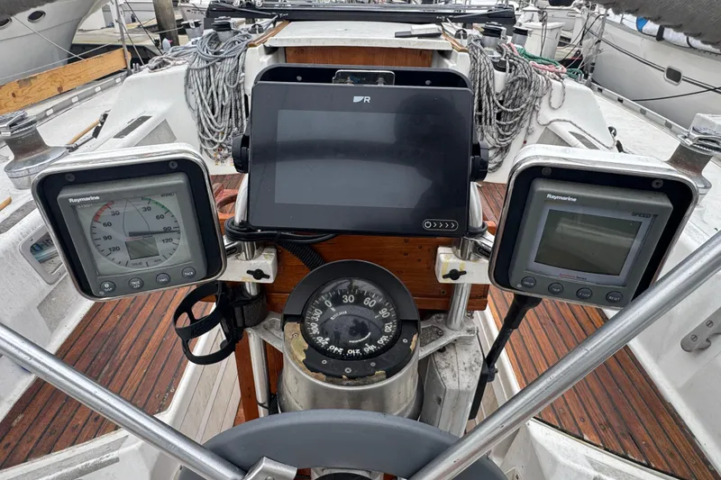 Slide: The Image of Cockpit of 1985 Beneteau First 38 sailboat with navigation instruments and compass. - 6