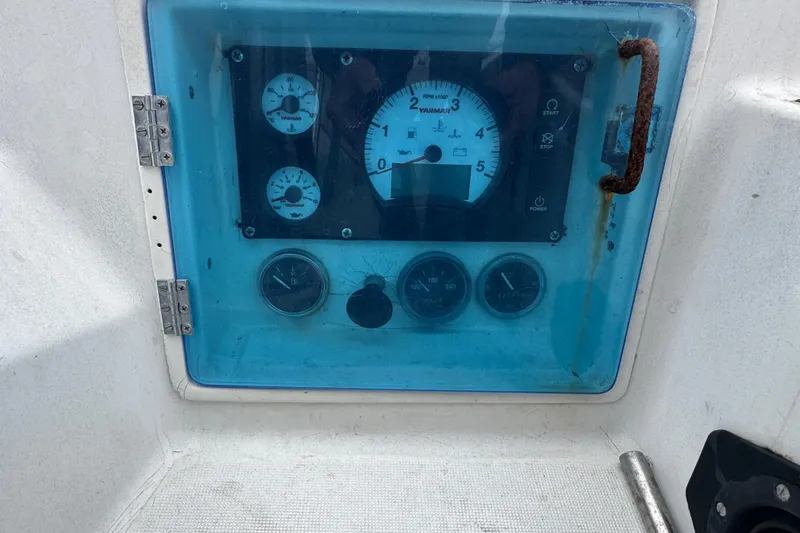 Slide: The Image of Control panel of a 1985 Beneteau First 38 sailboat with gauges and rusted handle. - 8