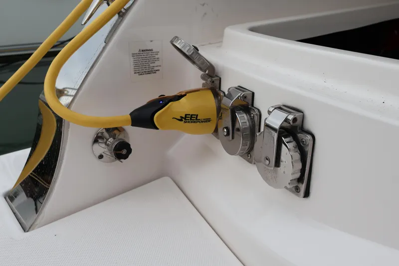 Slide: The Image of Engine compartment of a 2022 Regal 36 XO boat with red machinery. - 12