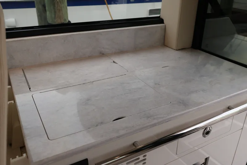 Slide: The Image of Control panel on 2022 Regal 36 XO boat featuring Dometic system and various switches. - 32