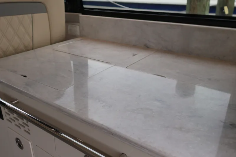 Slide: The Image of 2022 Regal 36 XO yacht interior with sleek marble countertop design. - 33