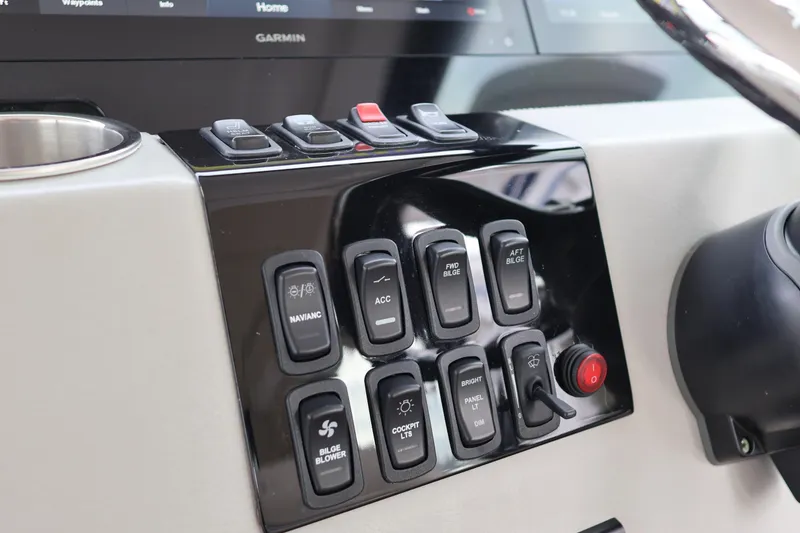 Slide: The Image of 2022 Regal 36 XO helm with dual Garmin displays and stainless steel steering wheel. - 37