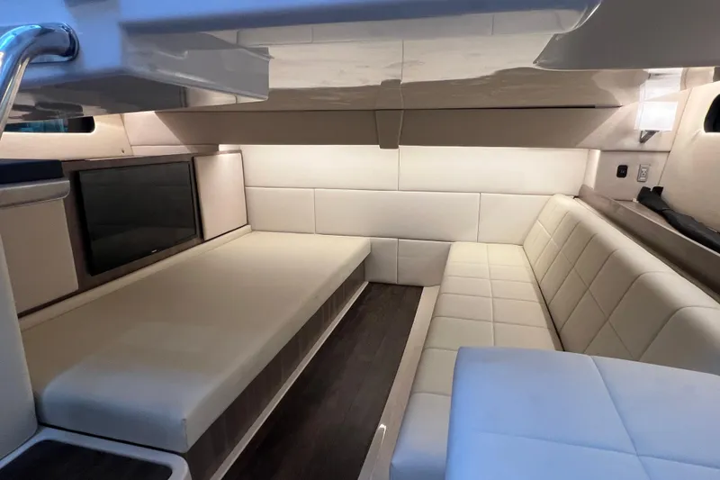 Slide: The Image of Interior of 2022 Regal 36 XO yacht with cozy seating and decorative pillows. - 47