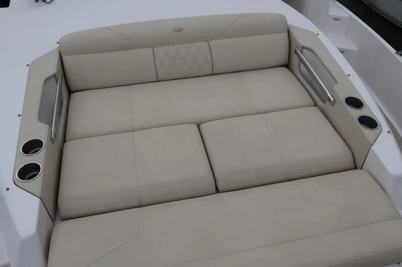 Slide: The Image of 2022 Regal 36 XO boat with comfortable seating and cup holders. - 58