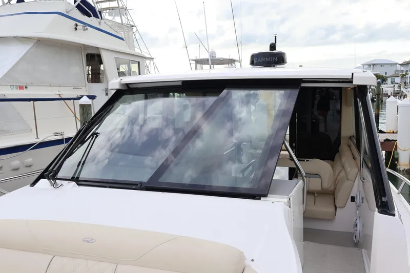 Slide: The Image of Luxurious seating area on 2022 Regal 36 XO boat with cup holders. - 60