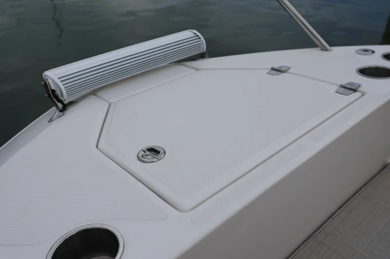 Slide: The Image of 2022 Regal 36 XO boat bow with cup holders and storage compartment. - 63