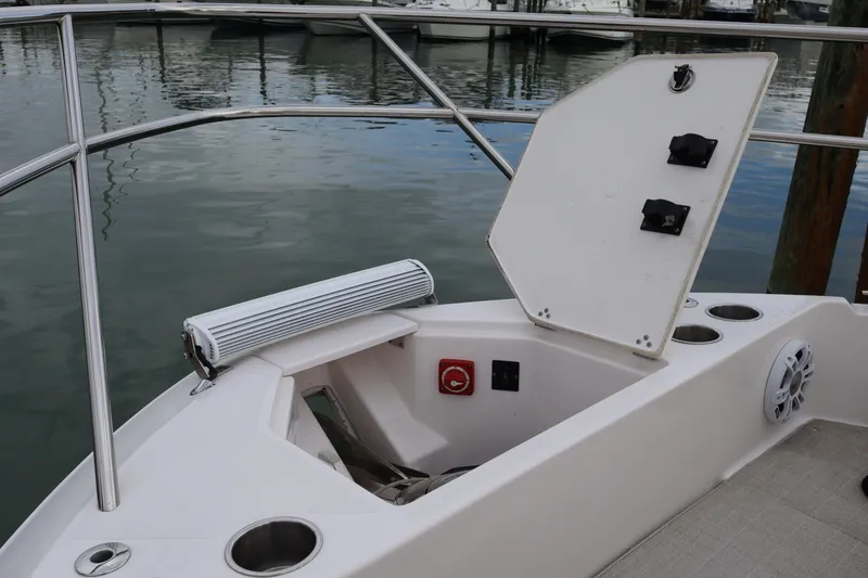 Slide: The Image of 2022 Regal 36 XO anchor locker with open hatch and winch. - 65