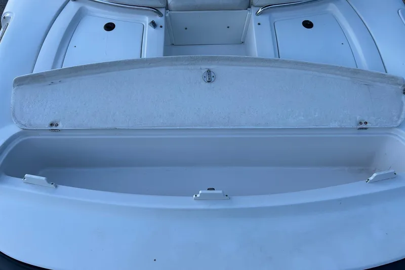 Slide: The Image of 2003 Four Winns 225 Sundowner boat storage compartment, open and empty. - 17