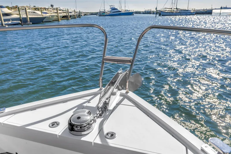 Slide: The Image of Bow view of 2020 Sealine C390 yacht on sparkling water, with marina in background. - 18