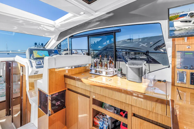 Slide: The Image of Luxurious interior of 2020 Sealine C390 yacht with modern navigation and bar area. - 36