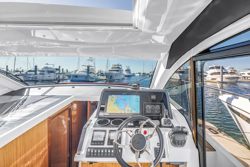 Slide: The Image of Helm of 2020 Sealine C390 yacht with navigation display, docked at marina. - 39