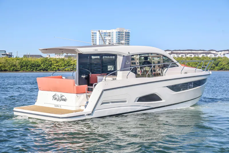 Slide: The Image of 2020 Sealine C390 yacht cruising on water near urban skyline. - 4