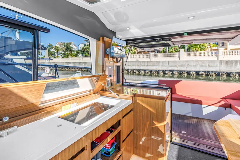 Slide: The Image of Interior of 2020 Sealine C390 yacht with modern kitchen and seating area. - 42