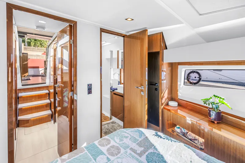 Slide: The Image of Luxurious interior of 2020 Sealine C390 yacht with modern wood finishes and natural light. - 44