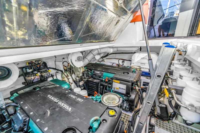Slide: The Image of Engine room of 2020 Sealine C390 yacht featuring Volvo Penta engines and mechanical components. - 52
