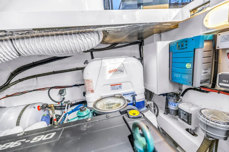Slide: The Image of Engine room of 2020 Sealine C390 yacht with generator and electrical components. - 54