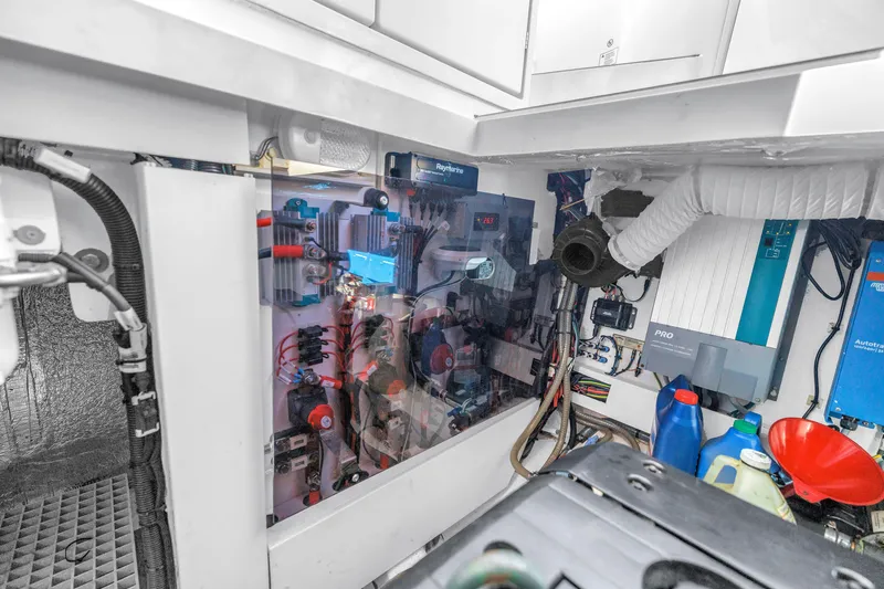 Slide: The Image of Engine room of 2020 Sealine C390 yacht, showcasing electrical systems and components. - 56