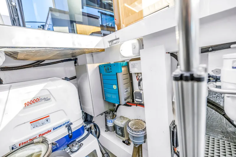 Slide: The Image of Engine room of 2020 Sealine C390 yacht with Fischer Panda generator and electrical components. - 58