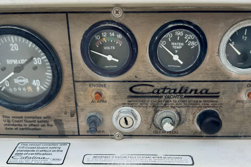 Slide: The Image of Control panel of a 1986 Catalina 36 yacht with gauges and switches. - 15