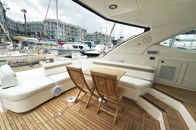 Slide: The Image of Luxurious 2010 Sea Ray Sundancer 540 yacht interior with wooden deck and seating area. - 11