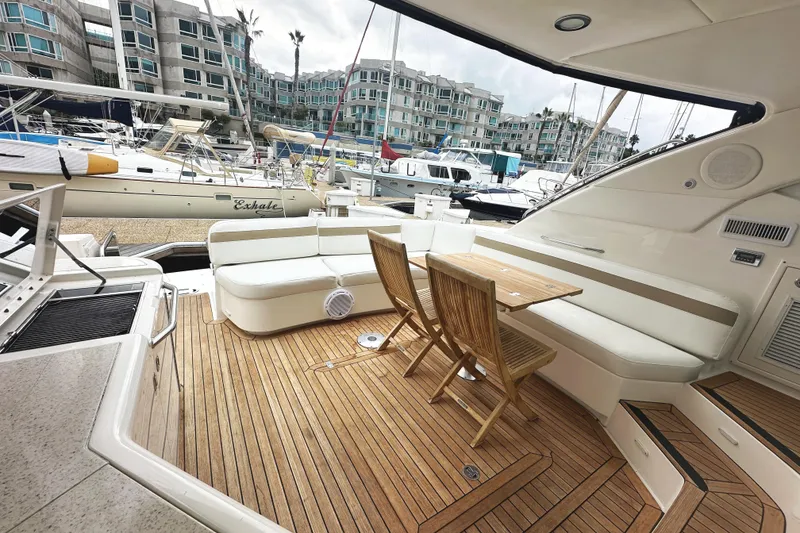 Slide: The Image of Luxurious 2010 Sea Ray Sundancer 540 yacht with elegant teak deck and marina view. - 12