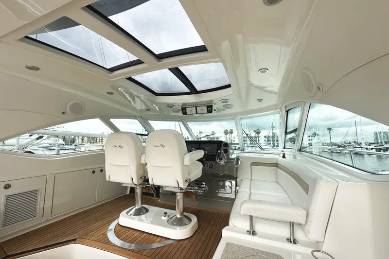 Slide: The Image of Luxurious interior of 2010 Sea Ray Sundancer 540 yacht with panoramic windows and plush seating. - 18