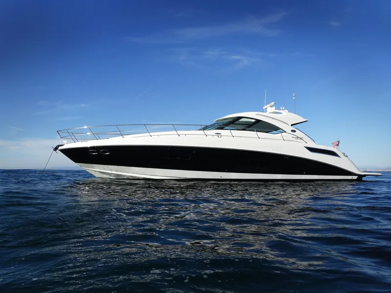 Slide: The Image of 2010 Sea Ray Sundancer 540 luxury yacht on open water. - 2