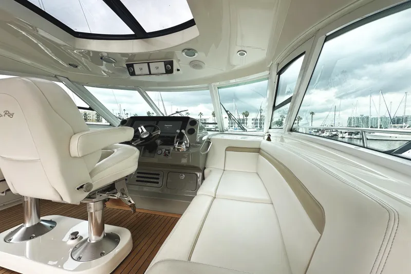 Slide: The Image of Luxurious interior of 2010 Sea Ray Sundancer 540 yacht with helm and seating area. - 20