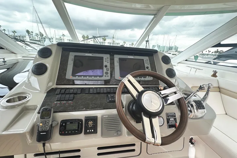 Slide: The Image of Helm of 2010 Sea Ray Sundancer 540 yacht with advanced navigation controls. - 24
