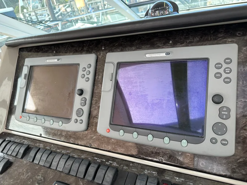 Slide: The Image of Control panel of a 2010 Sea Ray Sundancer 540 yacht with dual display screens. - 26