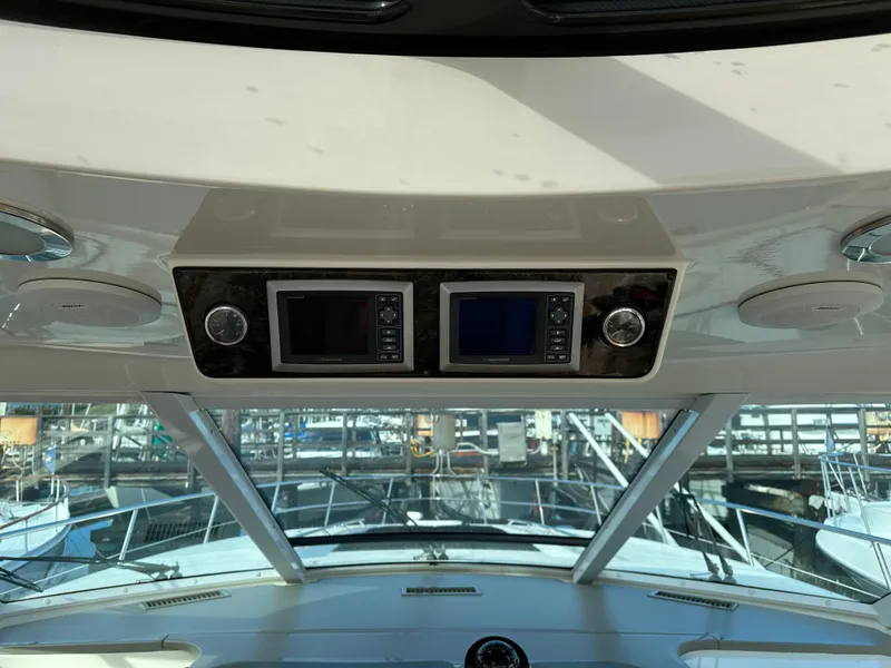 Slide: The Image of 2010 Sea Ray Sundancer 540 helm with dual navigation screens. - 27