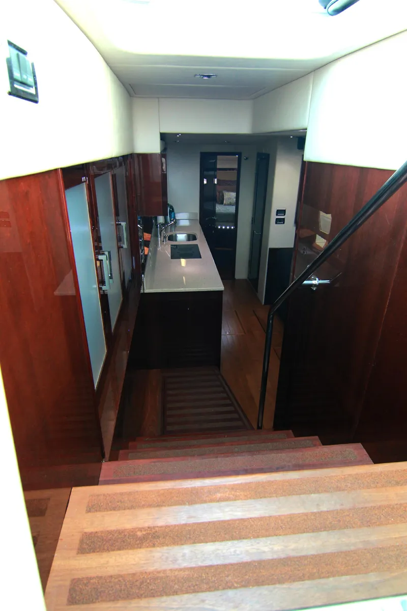 Slide: The Image of Interior of 2010 Sea Ray Sundancer 540 yacht with modern kitchen and wooden stairs. - 29