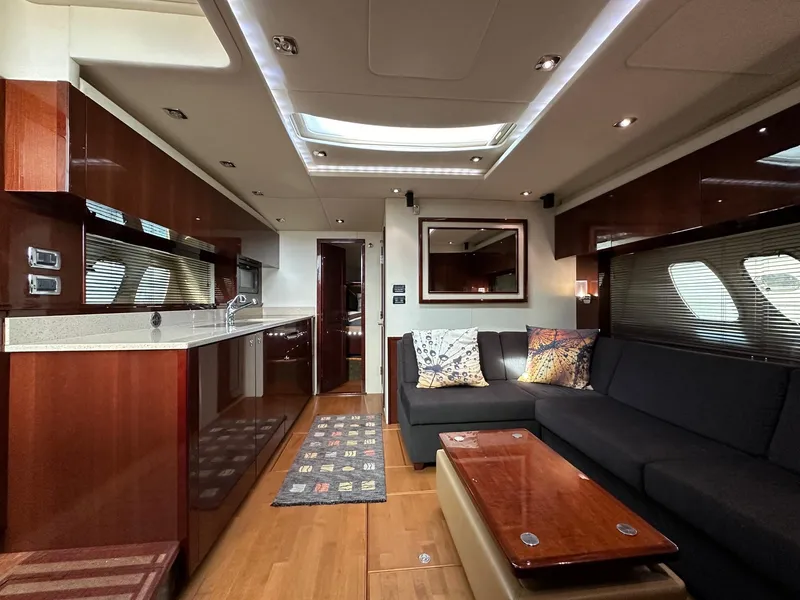 Slide: The Image of Luxurious interior of 2010 Sea Ray Sundancer 540 yacht with modern kitchen and cozy seating area. - 31