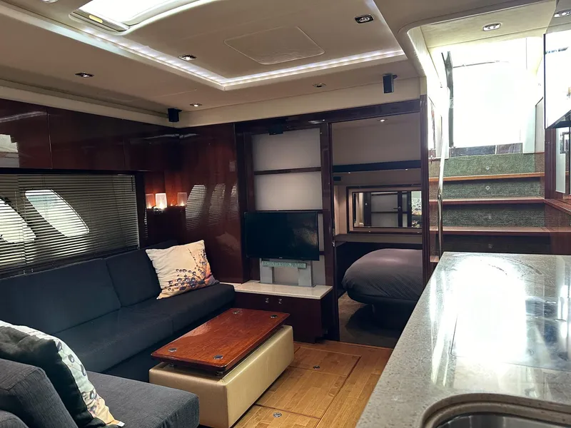 Slide: The Image of Luxurious interior of a 2010 Sea Ray Sundancer 540 yacht with modern furnishings. - 33