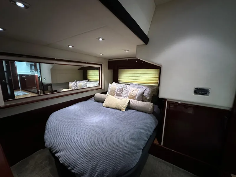 Slide: The Image of Luxurious bedroom in 2010 Sea Ray Sundancer 540 yacht with cozy bedding. - 35