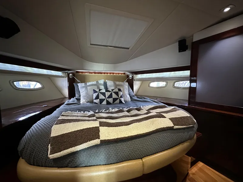 Slide: The Image of Luxurious bedroom interior of 2010 Sea Ray Sundancer 540 yacht with cozy bedding. - 39