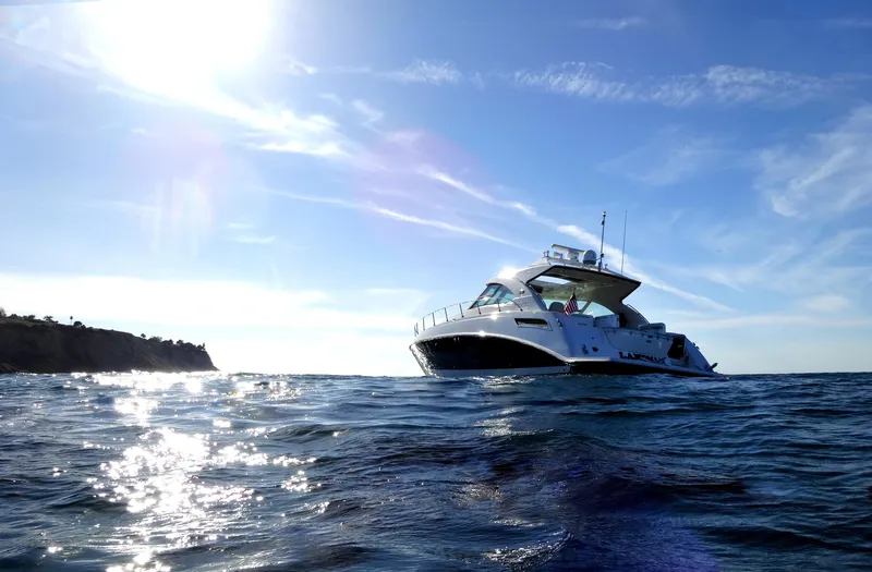 Slide: The Image of 2010 Sea Ray Sundancer 540 yacht cruising on sunny ocean. - 4