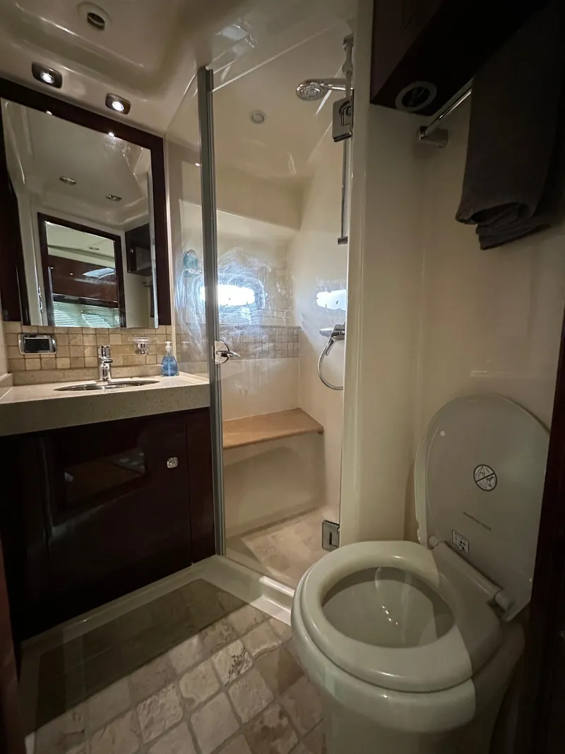 Slide: The Image of 2010 Sea Ray Sundancer 540 yacht bathroom with shower, sink, and toilet. - 40