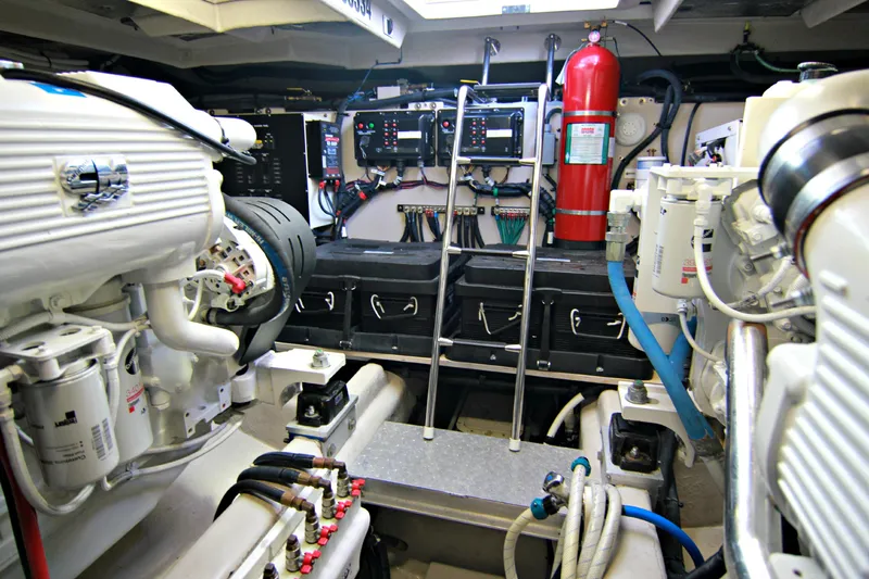 Slide: The Image of Engine room of a 2010 Sea Ray Sundancer 540 yacht with visible machinery and equipment. - 42