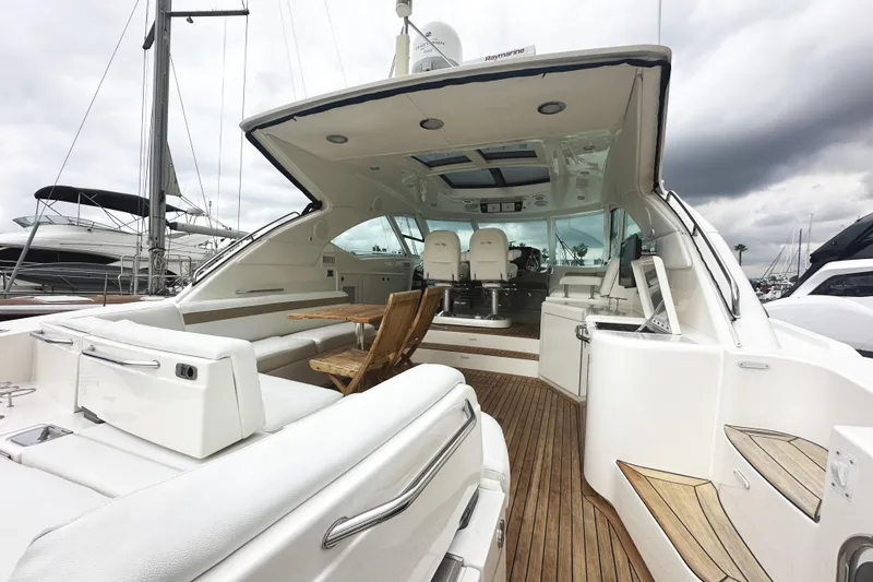 Slide: The Image of Luxurious 2010 Sea Ray Sundancer 540 yacht interior with elegant seating and wooden deck. - 9