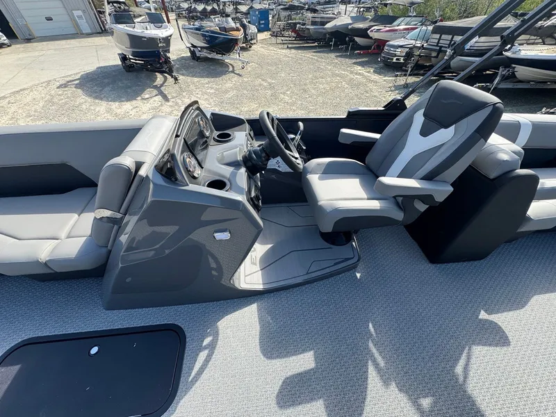 Slide: The Image of Evotti 525QL boat 2026, modern cockpit design, gray upholstery. - 13